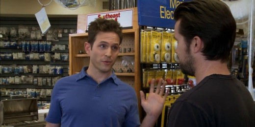 A still from Always Sunny in Philadelphia. Dennis is speaking to Mack in a hardware store. 