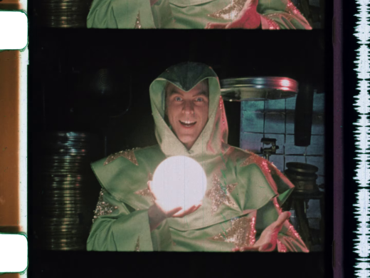 A still from the short The Wizard of Speed and Time showing the titular wizard holding a glowing sphere.