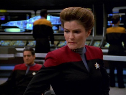 There's MegaMan in that nebula! A still showing Katie Mulgrue as captain Kathryn Janeway in Star Trek: Voyager.