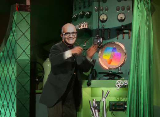 I fed it your future and it told me I'm a genius! A still from the film The Wizard of Oz with Satya Nadella's head photoshopped onto the wizard and the CoPilot logo photoshopped onto his machine's valves.